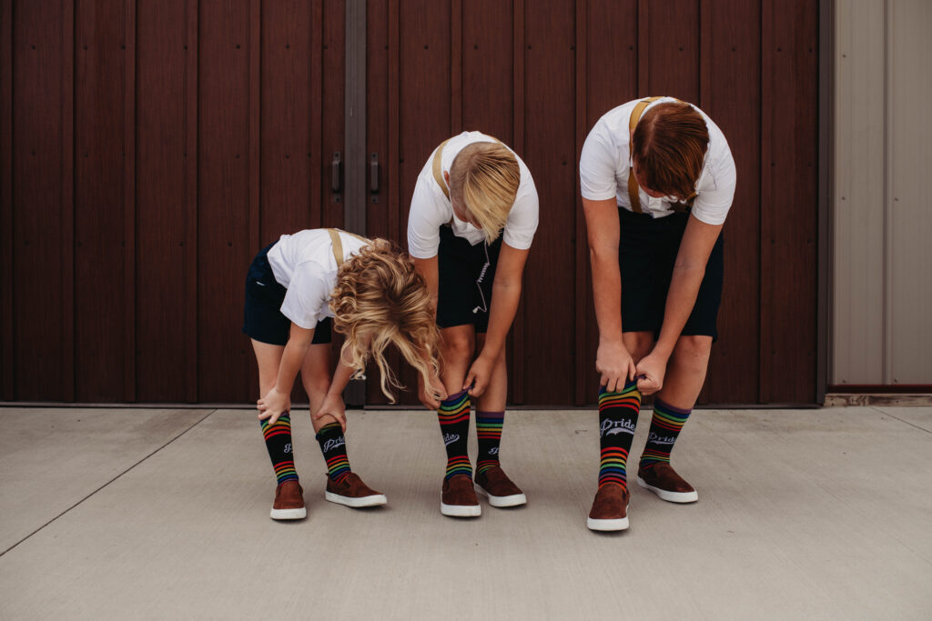 Ring bearers wear Pride socks to support their Aunts getting married.
