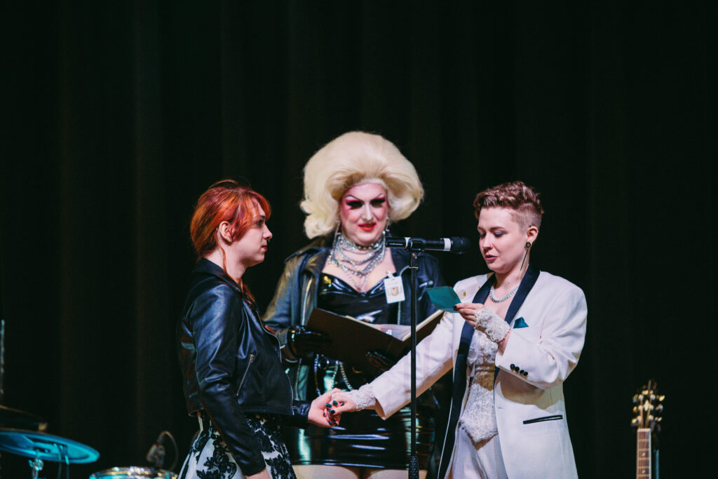 Trans couple read personalized vows with their beautiful Drag Queen officiant.