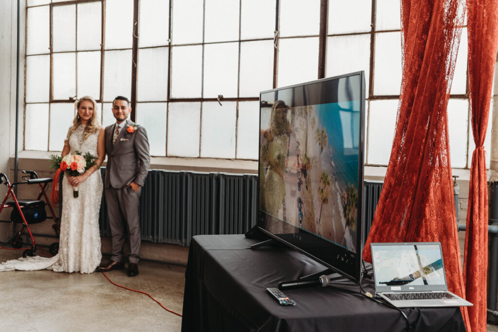Bride and Groom surprise their guests with a video of them getting eloped in California at The Screw Factory in Cleveland.