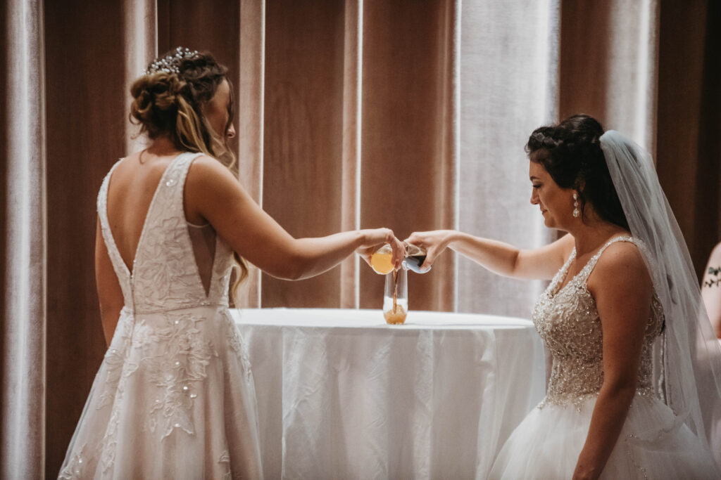 Two brides blend their favorite beers together for their ceremony.