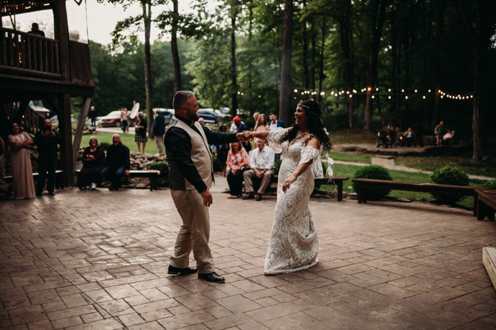 Newlyweds have first dance outside at Glenmont wedding venue in Mohican.