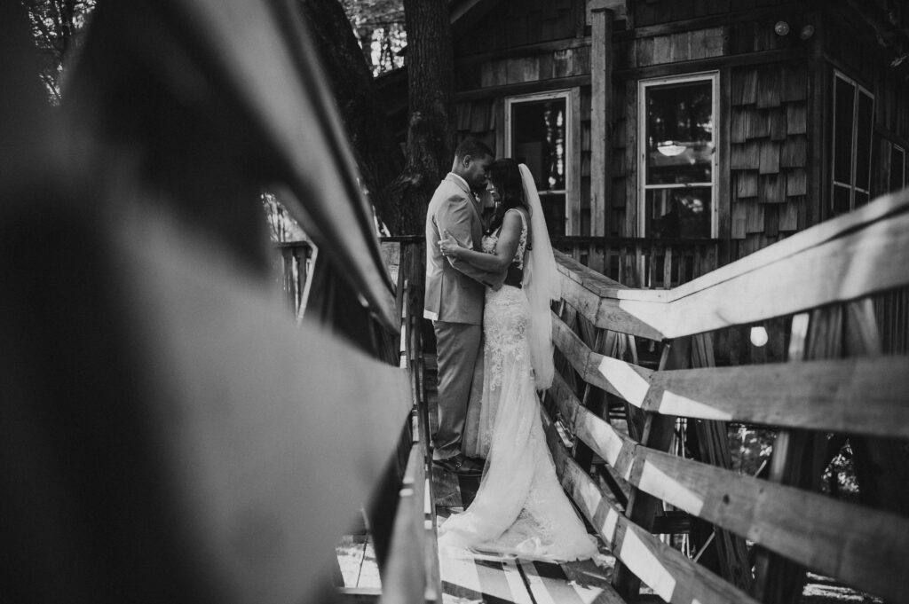 Small wedding at Mohican treehouse on tall bridge.