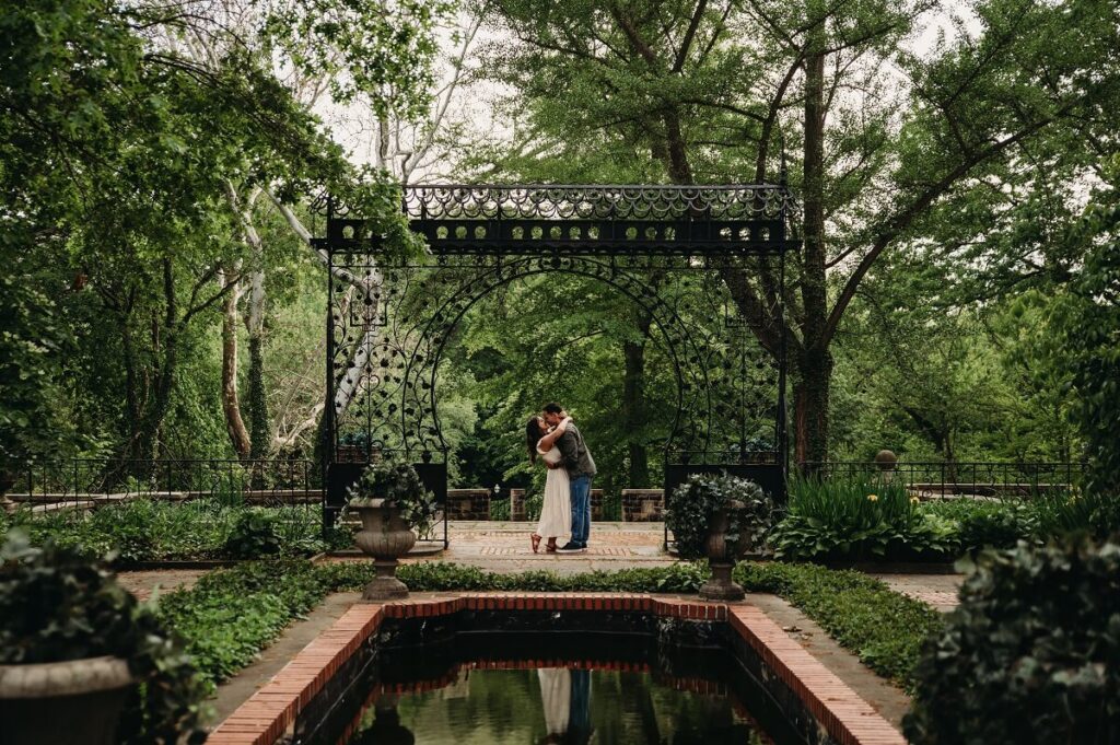 Garden surrounds couple in spring at Cleveland Cultural Gardens.