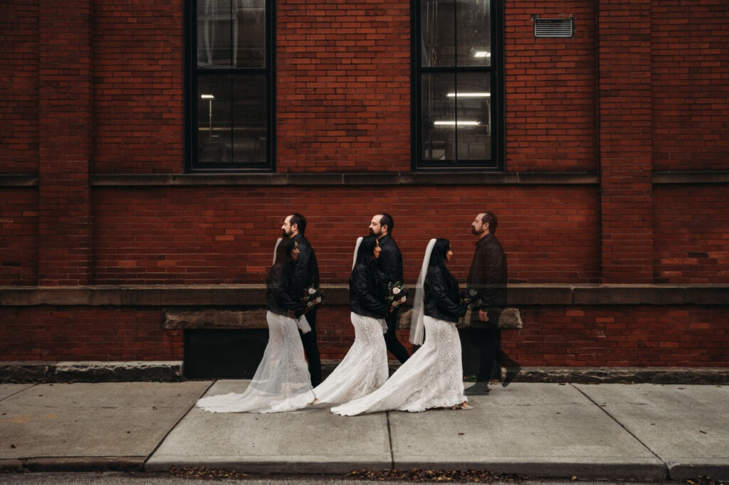 Unique and alternative wedding photo of couple walking towards each other outside Great Lakes Brewery Tasting Room