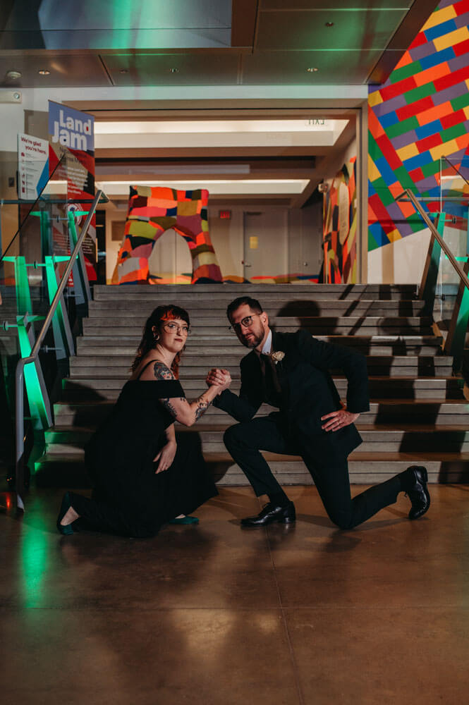 Couple poses as hardstyle for the reception entrance at Akron Art Museum.