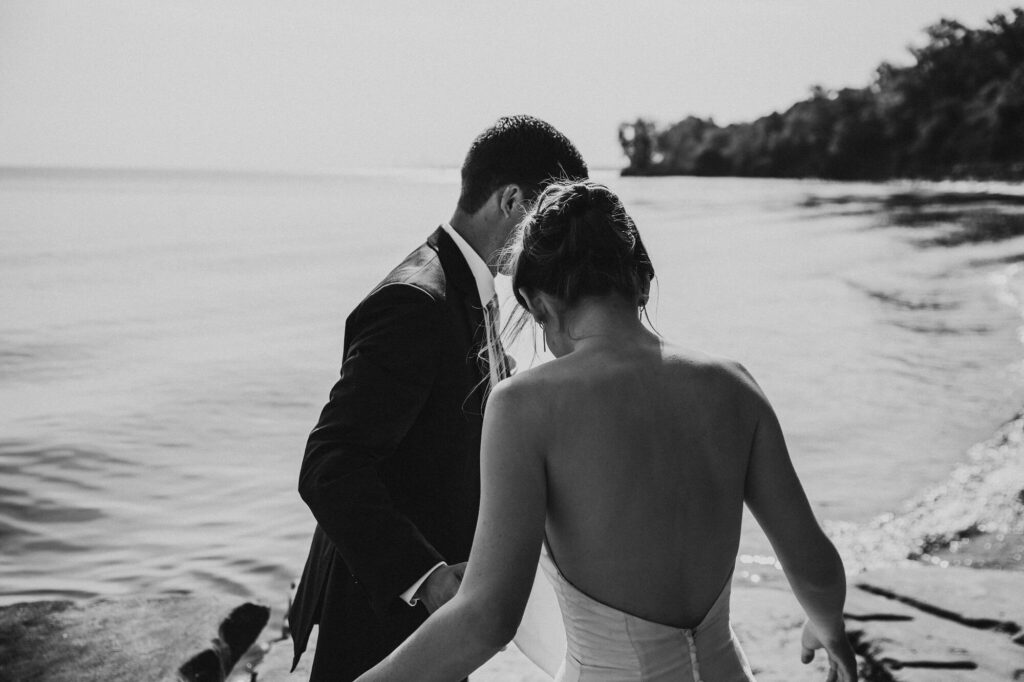 Unique black and white photo of beach elopement in Cleveland at Hunington Beach.