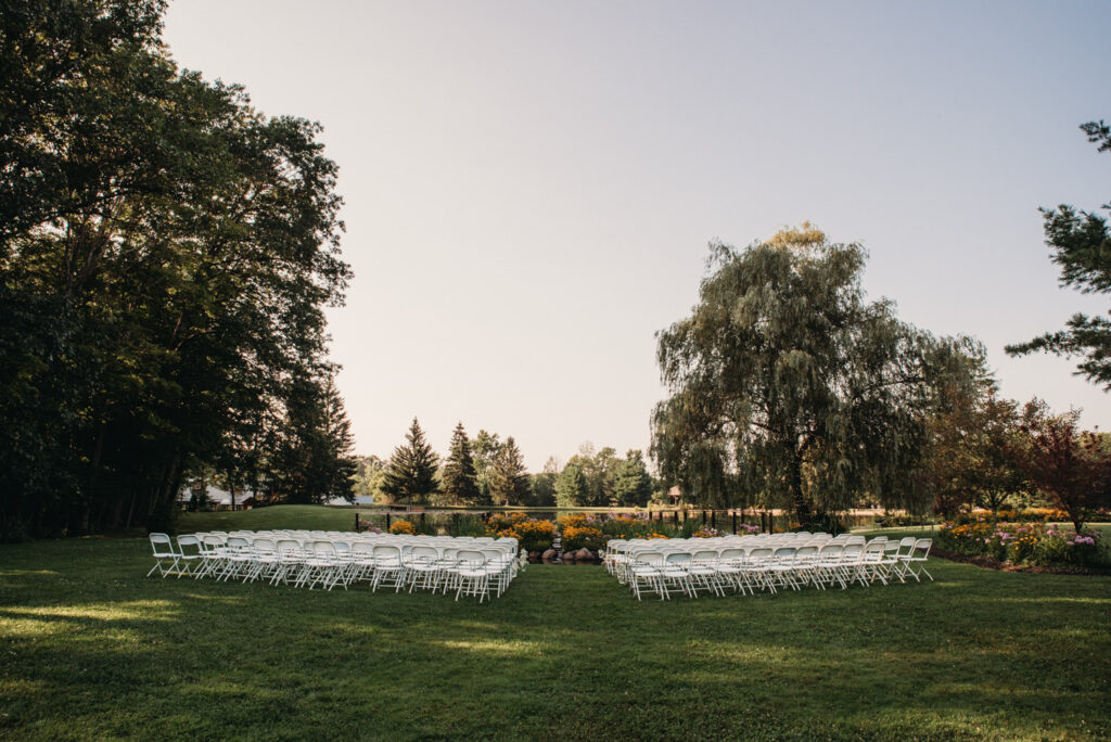 Open concept ceremony at wildflower venue during the summer.