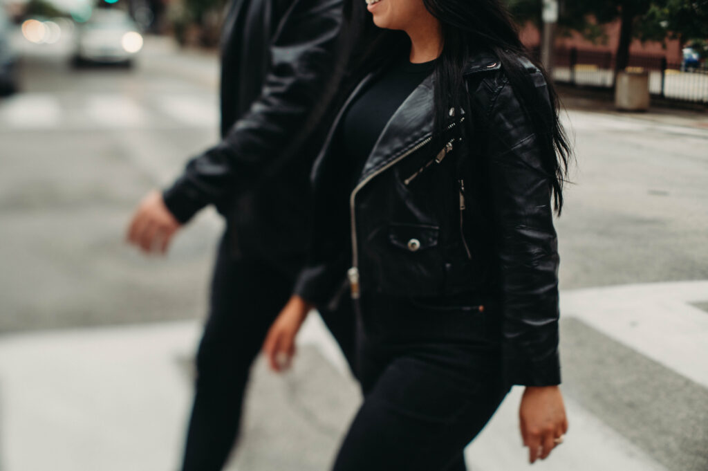 Alternative couple walk along urban road with an arsty tilt blur.