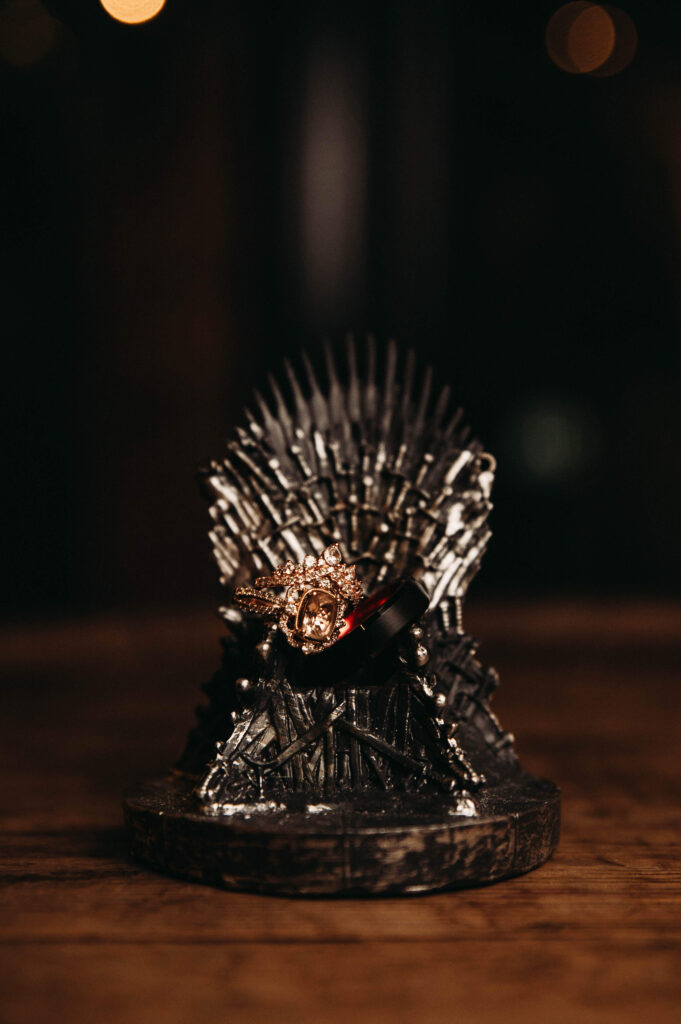 Medieval chair Game of Thrones themed wedding with rings detail.