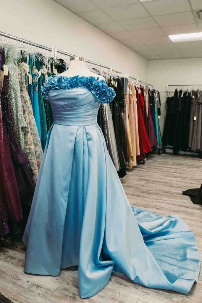 Blue and bright floral wedding dress available in multiple sizes at dress shop in Ohio.