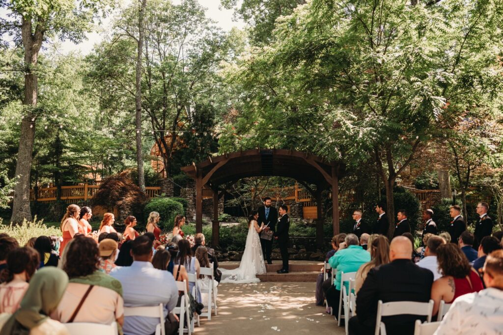 Ceremony in outside garden at Castle in Mohican