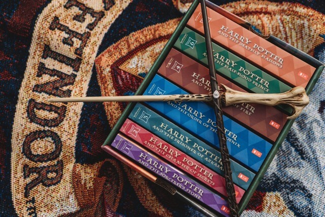Engagement ring with Harry Potter books and wands.