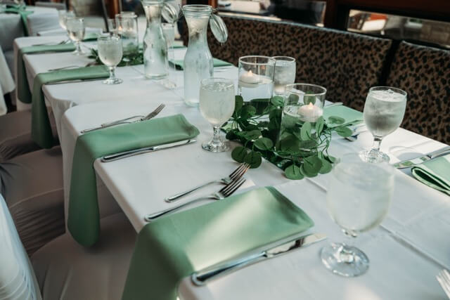 Green and white details at reception at Riverside Garden Venue