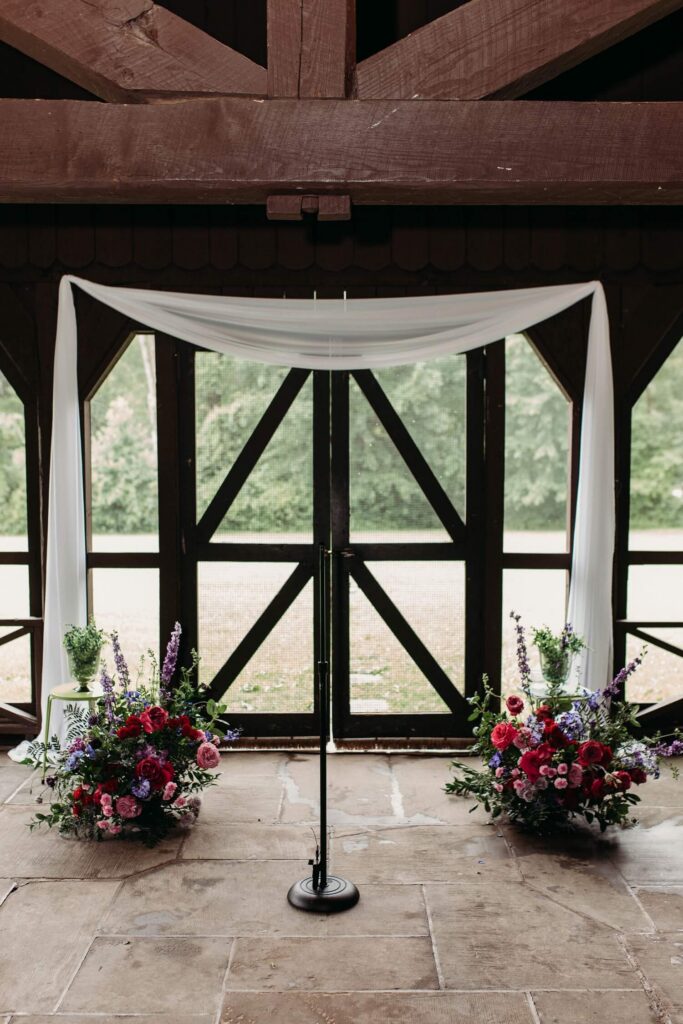 Ceremony set up in screen porch area at happy days venue