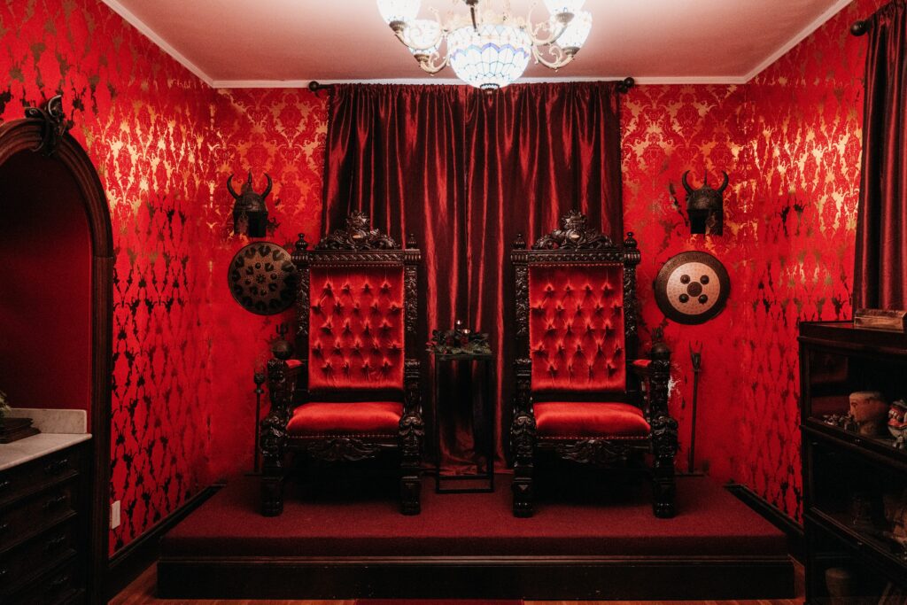Two red throne chairs at Salem Massachusetts wedding venue