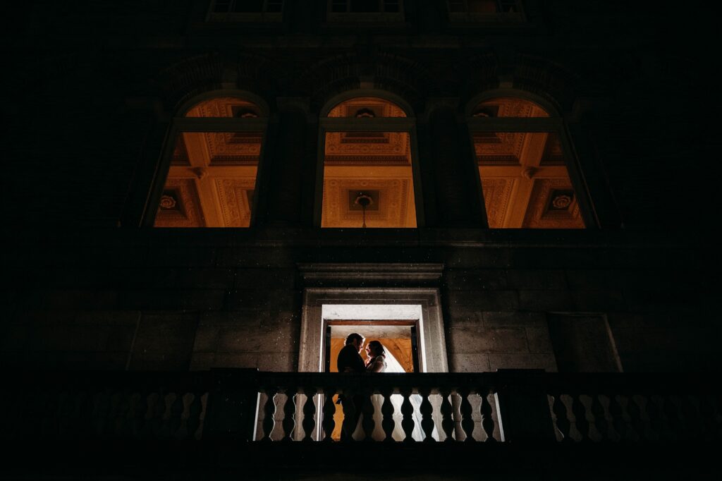 Courtyard balcony view for creative portrait during winter wedding in Boston.